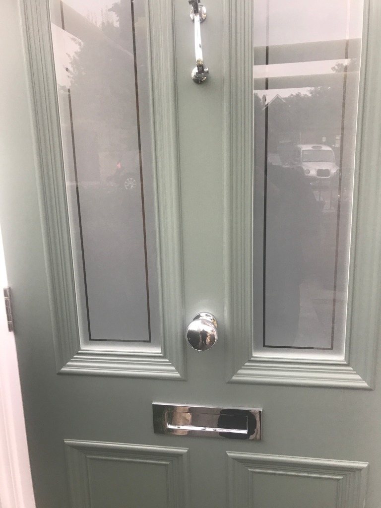 The light green finish complements the beautifully inlaid sandblasted glass.