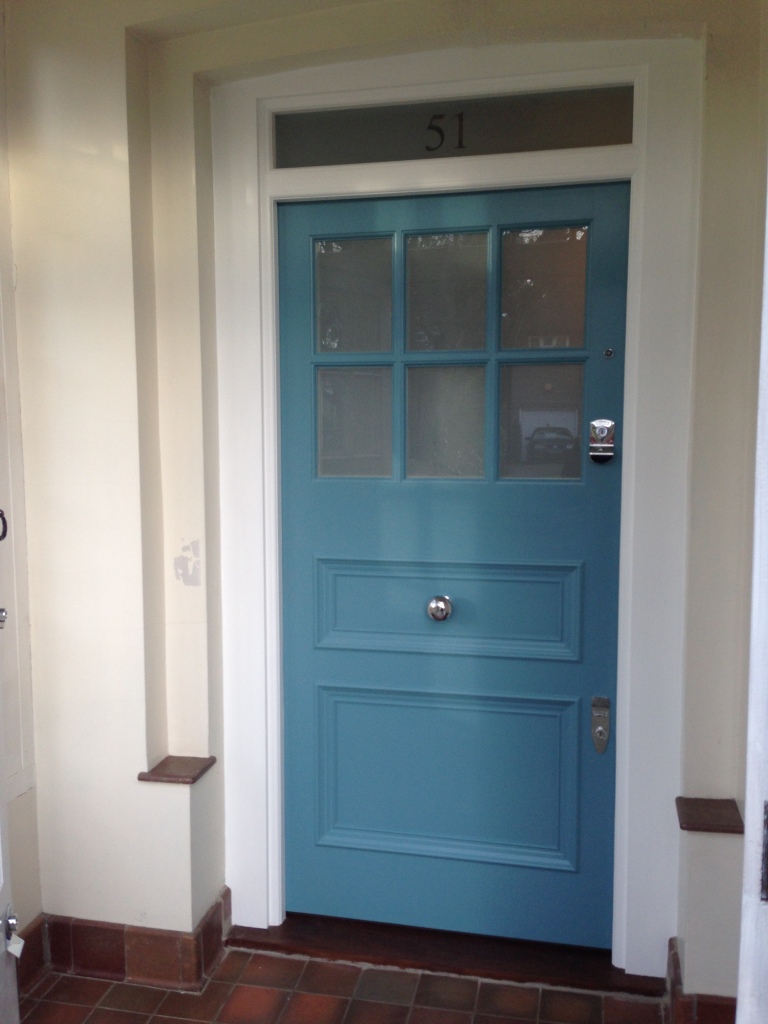 Victorian door with etched glazed panels and chrome  door furniture. 